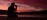 Person meditating cross-legged on a beach shoreline at sunrise - calm golden light for wellness