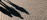 Practitioner’s shadow falling at a sharp oblique angle in strong light