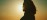 Practitioner silhouette against a coastal outdoor backdrop