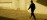 Practitioner silhouette in a quiet exterior courtyard