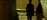 Practitioner silhouette pausing on an outdoor bridge