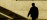 Practitioner silhouette framed within an exterior archway