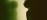 Interior silhouette of practitioner beside a warm floor lamp