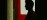 Practitioner silhouette behind gauze curtains in soft light