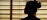 Interior silhouette of practitioner in warm evening light