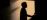 Practitioner silhouette framed in an interior arched opening