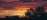 First light streaming across serene valley, inspiring visual brand storytelling